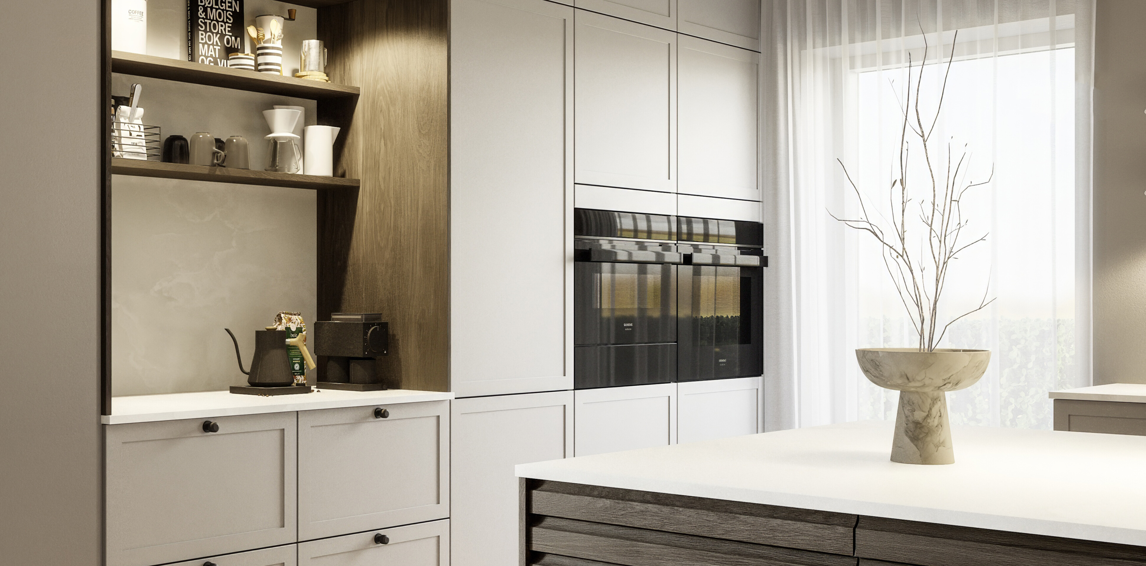 Designa har valgt Siemens som leverandør af hårde hvidevarer. På billedet ses et hvidt Designakøkken med en elegant sort ovn fra Siemens.